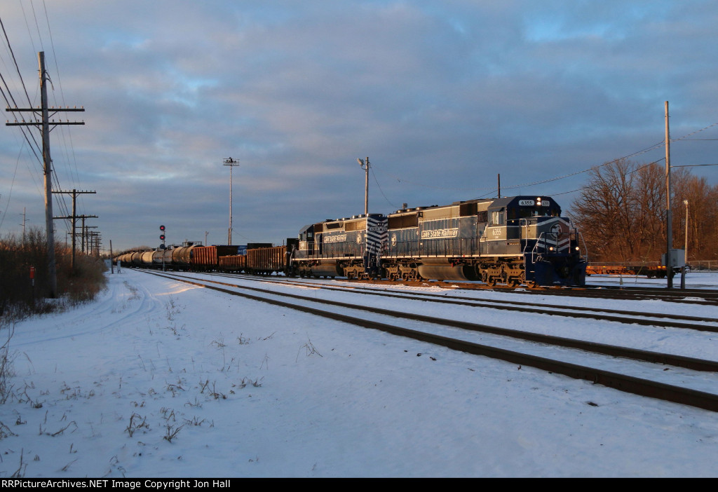 The morning sun shines on the 6355 & 6303 as the head north in to the yard